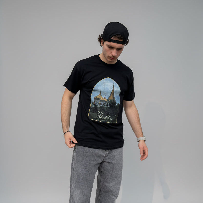 Man wearing black "at heaven's doorsill" T-Shirt